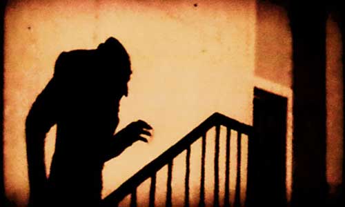 The iconic shadow of Count Orlock in Nosferatu (1922)