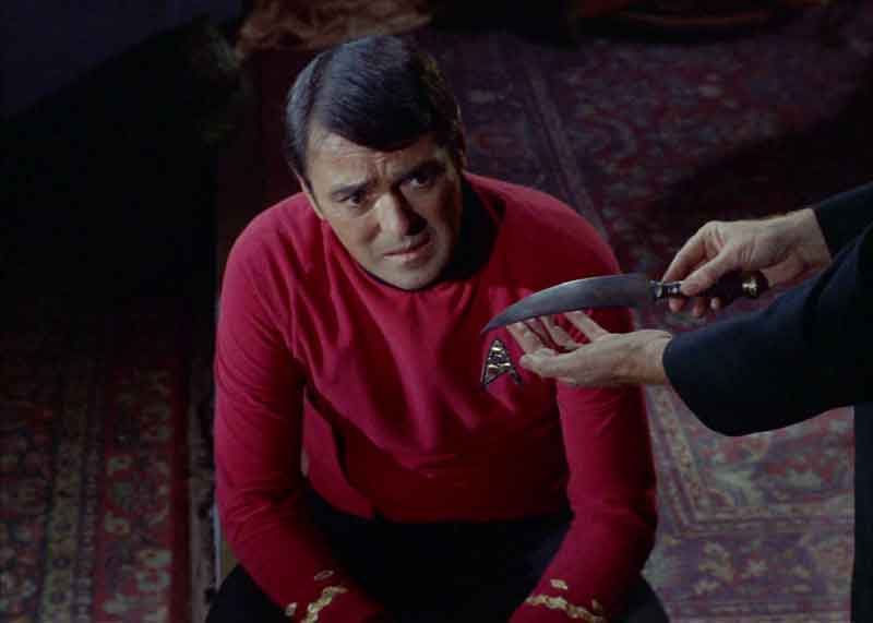 Scotty looks nervous being blamed for the Jack the Ripper Murders in Star Trek's Wolf in the Fold