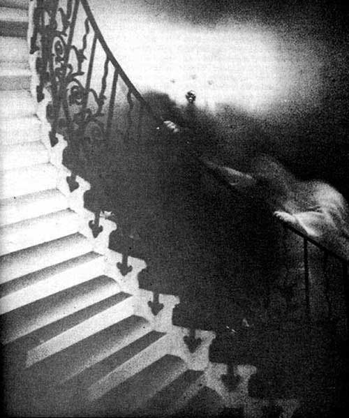 Photograph of the Tulip staircase showing ghostly figure, taken by the Rev Hardy in 1966