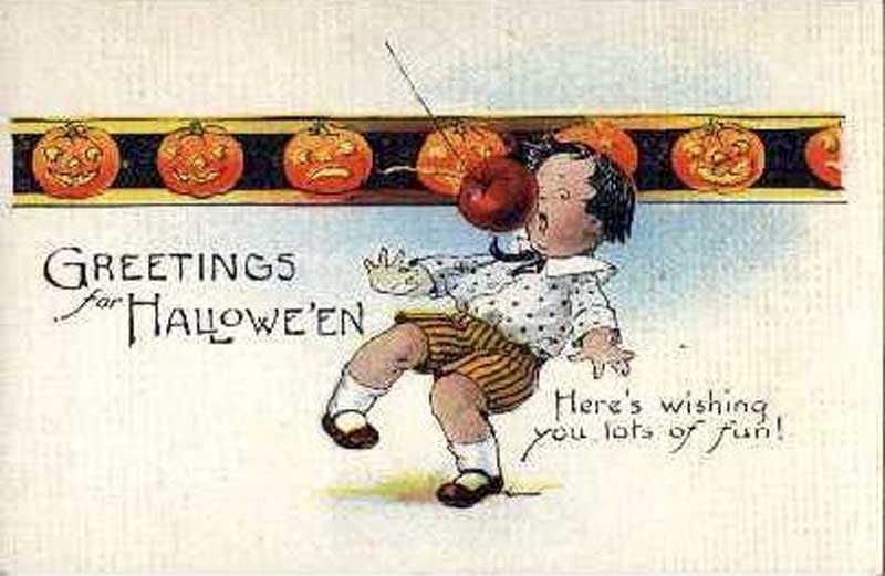 Apples play a big part in the Halloween traditions we love, as this vintage postcard shows
