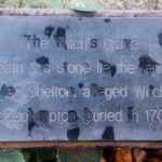 A close up of the plaque on the Witches Grave in Woodplumpton, Lancashire