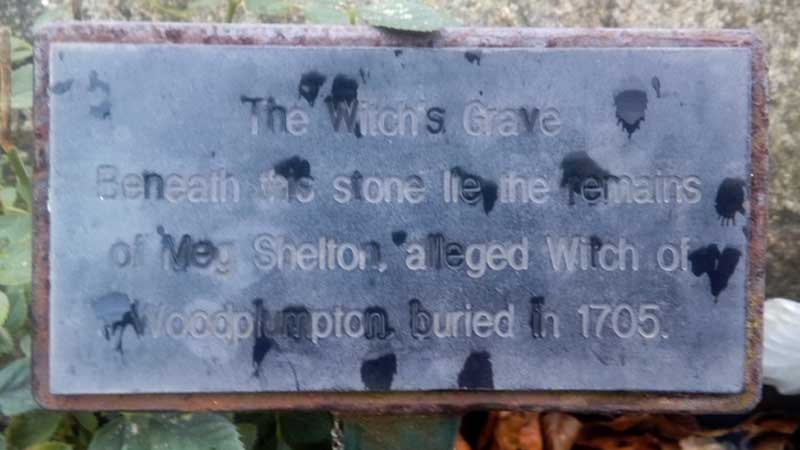 A close up of the plaque on the Witches Grave in Woodplumpton, Lancashire