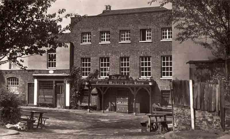 An old photograph of The Flask in Highgate, one of London's most haunted pubs