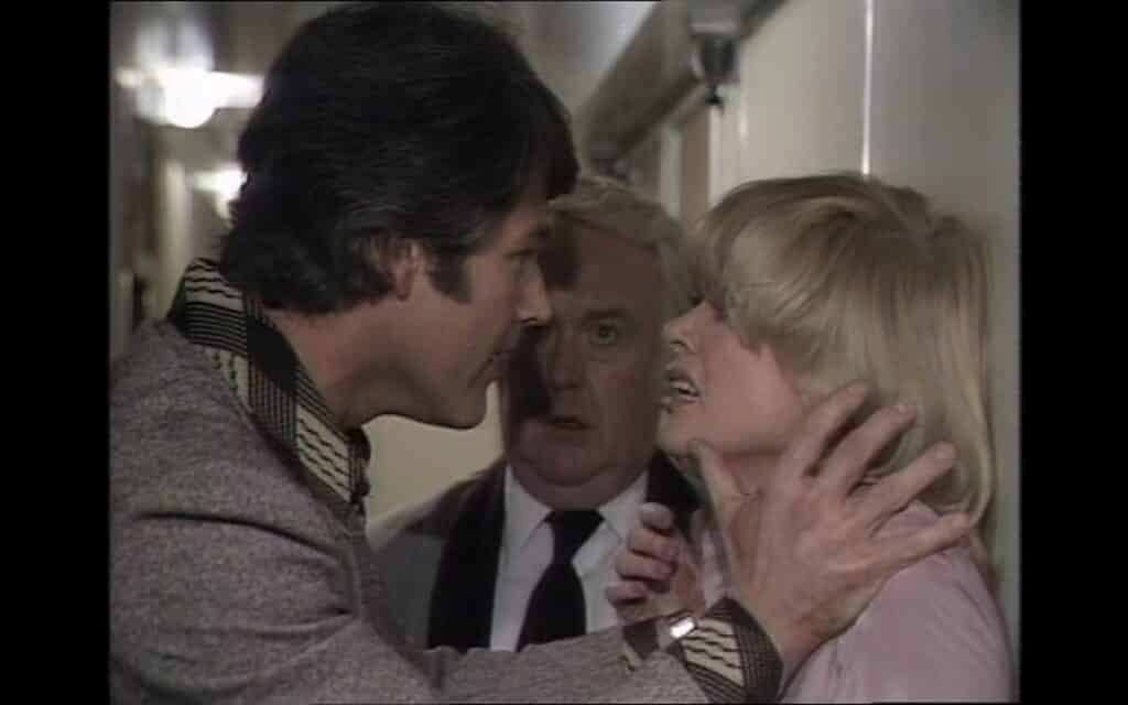 Bob Malory (James Smillie) tries to calm down Helen Marlow (Jusy Geeson) in the 1975 Thriller episode, Night Is The Time For Killing