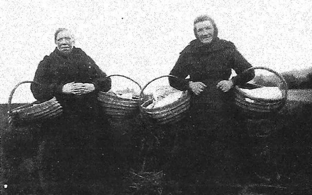 A photo of Isie Caie (on the right), thought to be the last fish wife in Cove in Scotland