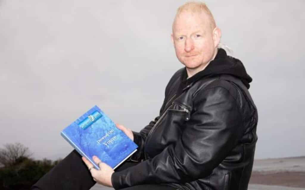 GhostÉire's Anthony Kerrigan with his book Drowned-Out Voices