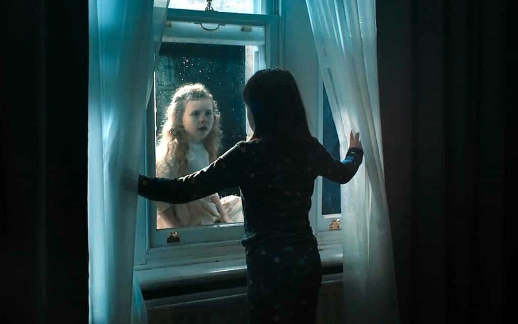 Leah (Kiera Thompson) receives a visitor (Sienna Sayer) in Martyrs Lane (2021).