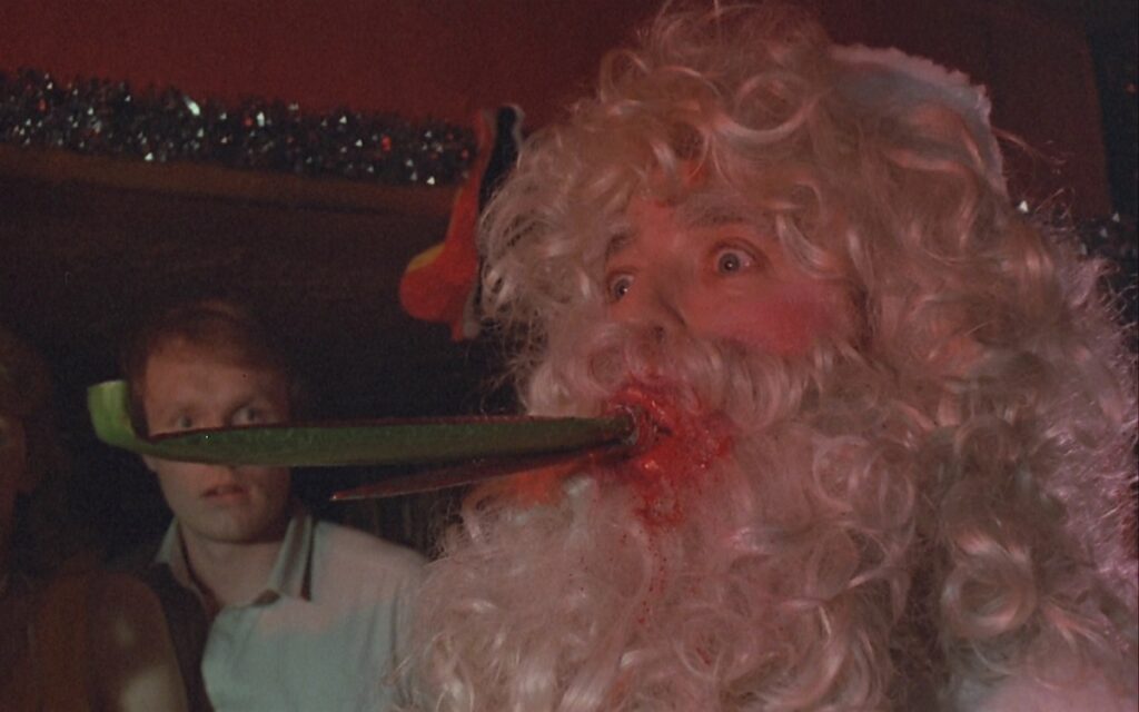 Surprise! An unfortunate Santa gets the point (sorry) in Don't Open Till Christmas (1984)