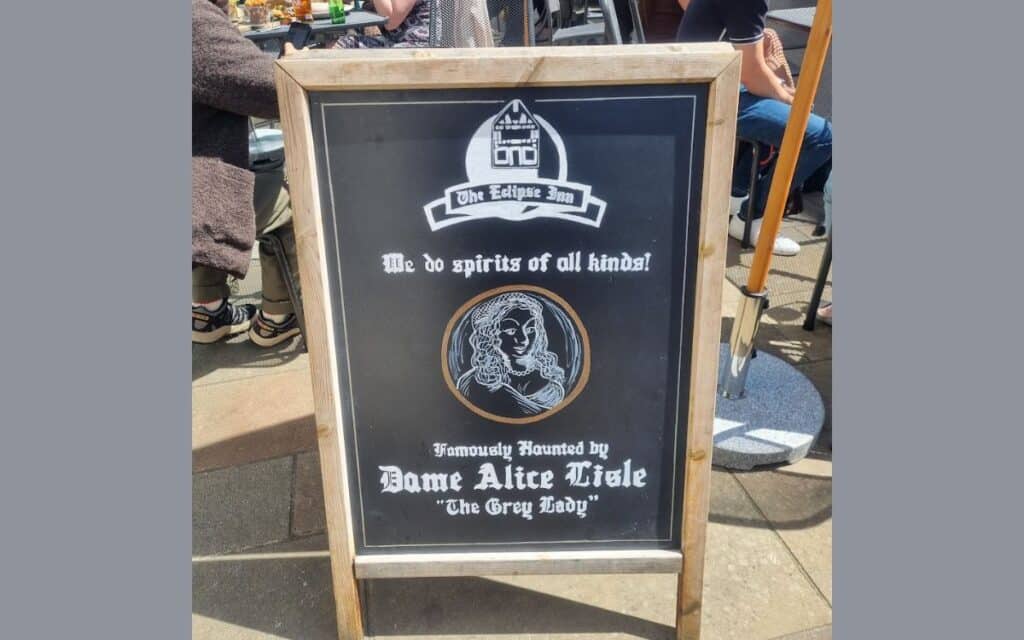 A board outside The Eclipse Inn proudly boasts of the haunting of Dame Alice Lisle.