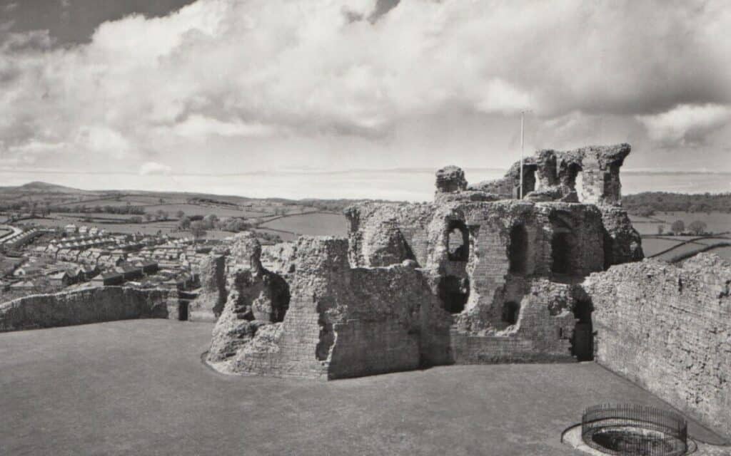 An old postcard showing Denbigh Castle.