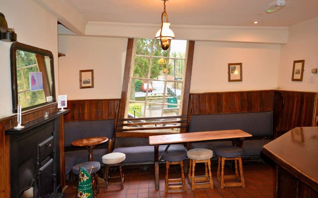 Inside the bar of The Crooked House, where only the hanging lamp appears to be vertical.