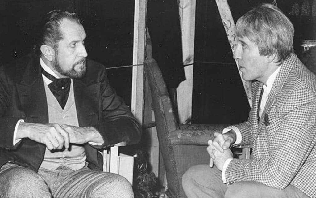 Vincent Price talks to Christopher Lee behind the scenes of The Oblong Box.