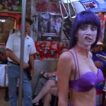 Frankenhooker 1990, a woman with purple hair and a purple wig in a subway
