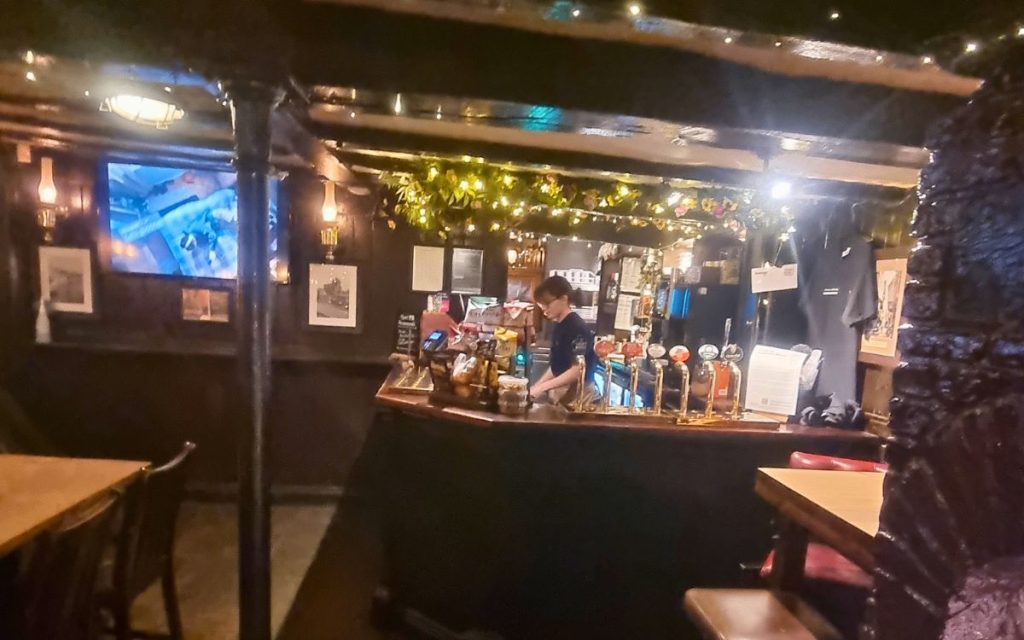 Bar area inside The Punch Bowl York with pumps and seating